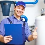 plumber posing with a thumbs up