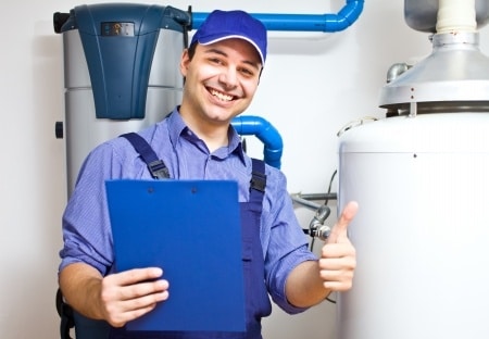 plumber posing with a thumbs up