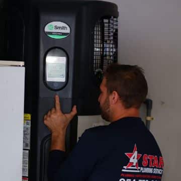 Professional 4 Star Plumbing staff performing water heater inspection