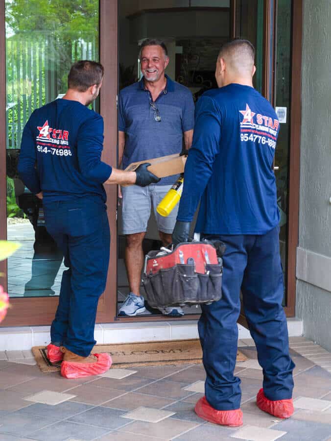 4 star plumbing services greeting residential customer at ft lauderdale home