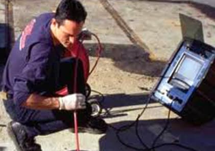 plumber inspecting drain