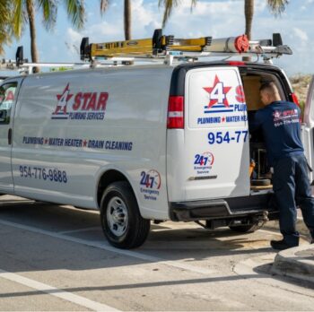 plumber loading equipment into work van