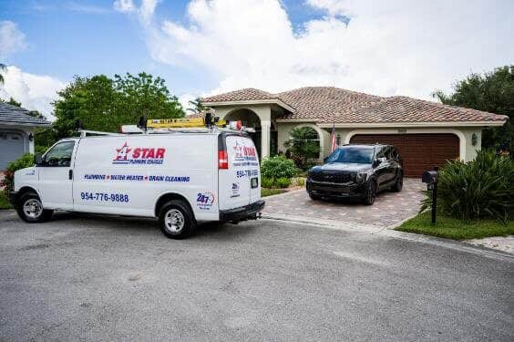 4 Star Plumbing Service van parked in front of a Fort Lauderdale, FL residential home