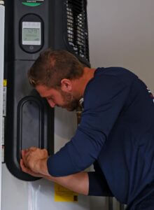 Man repairing water heater boiler