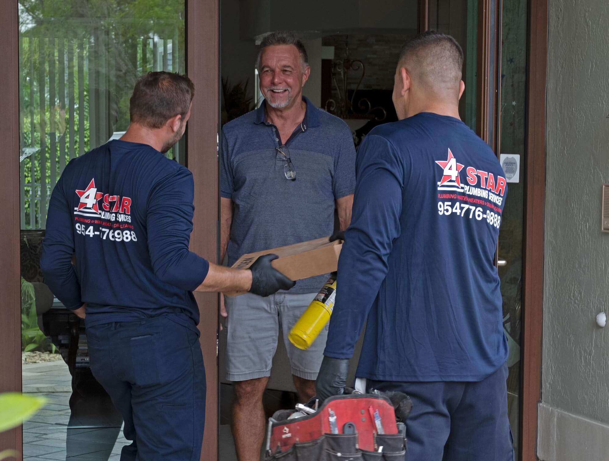 Plumbers visiting client home