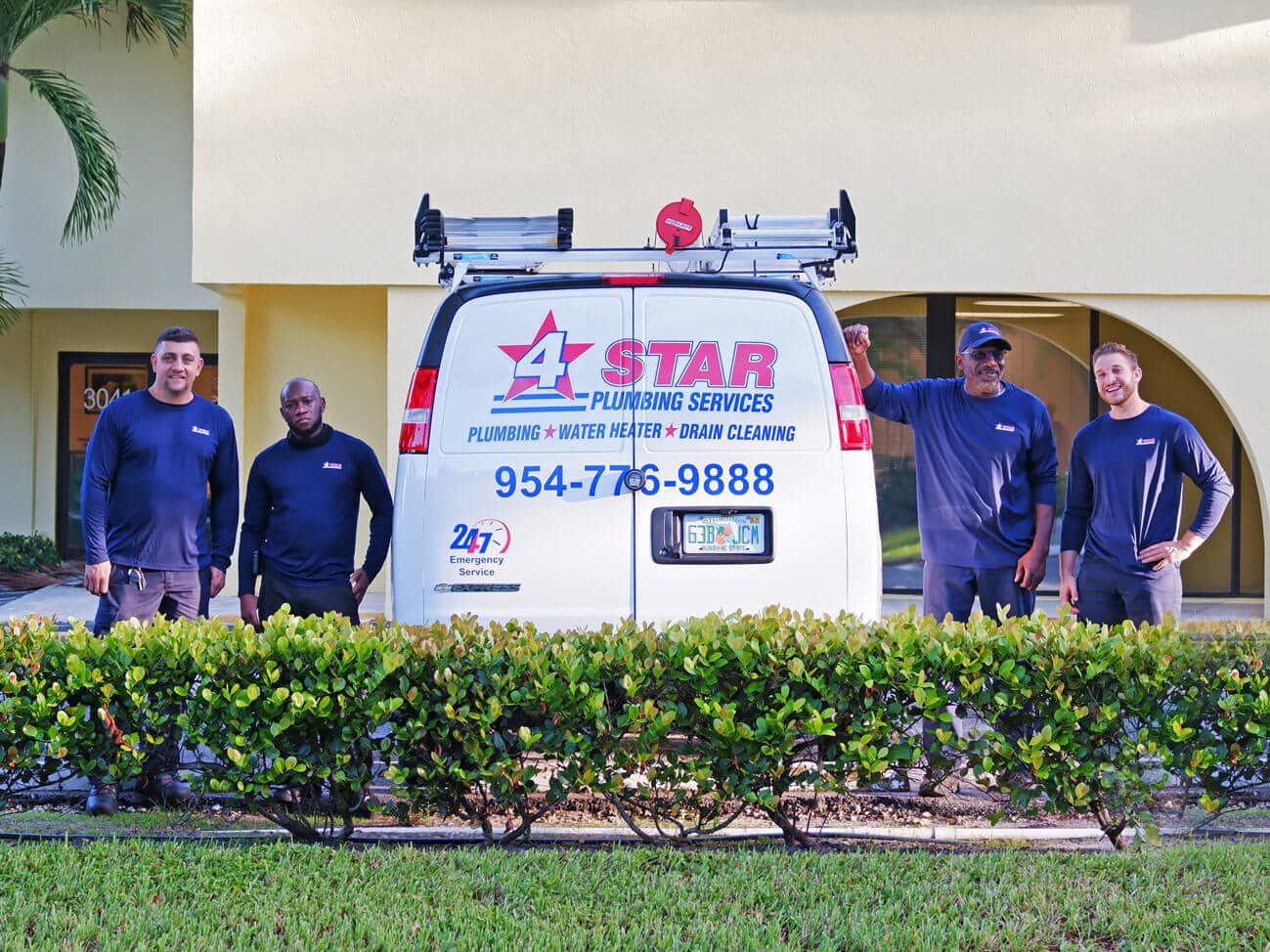 4 Star Plumbing Services van with employees standing by truck