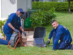Men using high-tech digital sewer repair machine