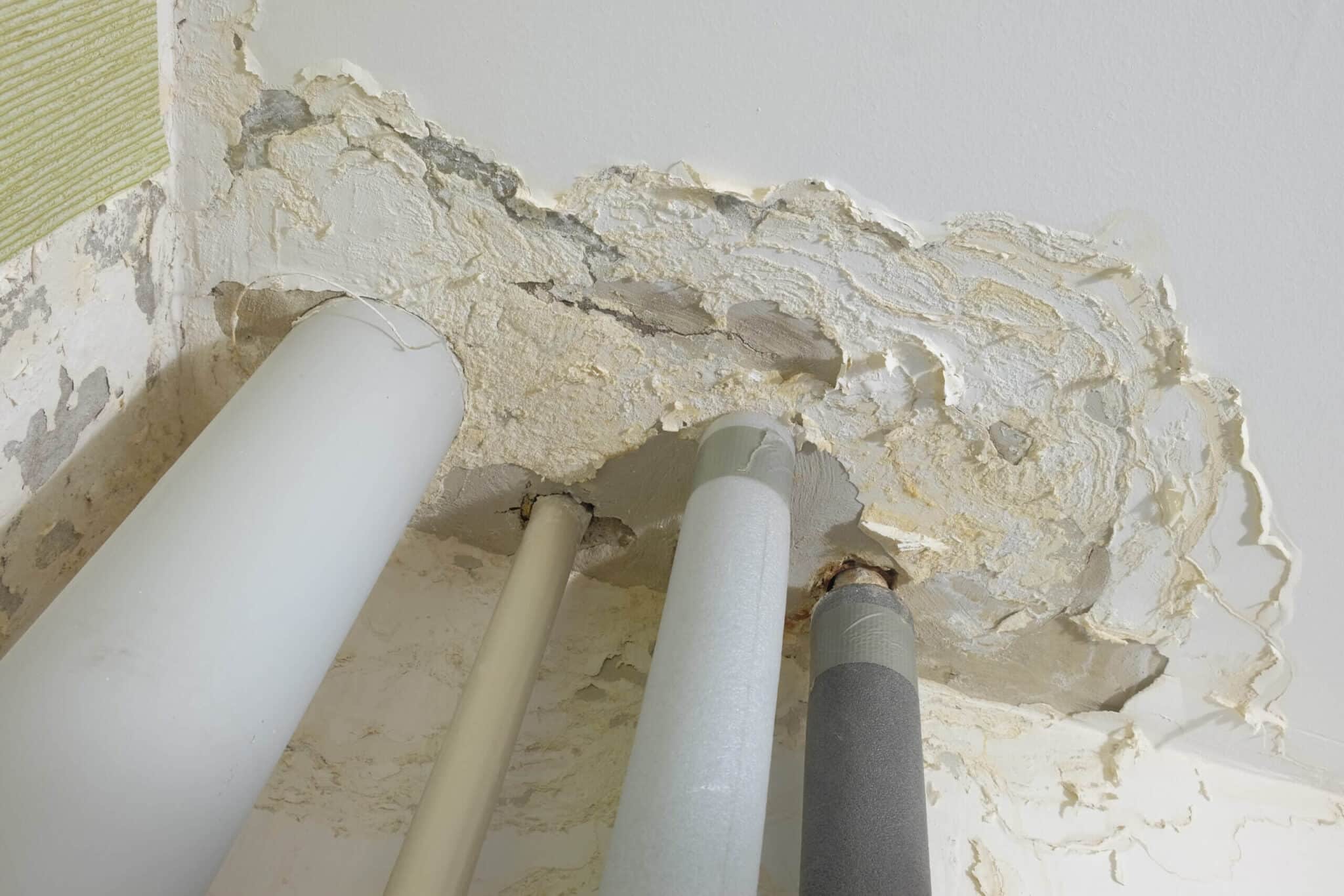 pipes leaking through wall