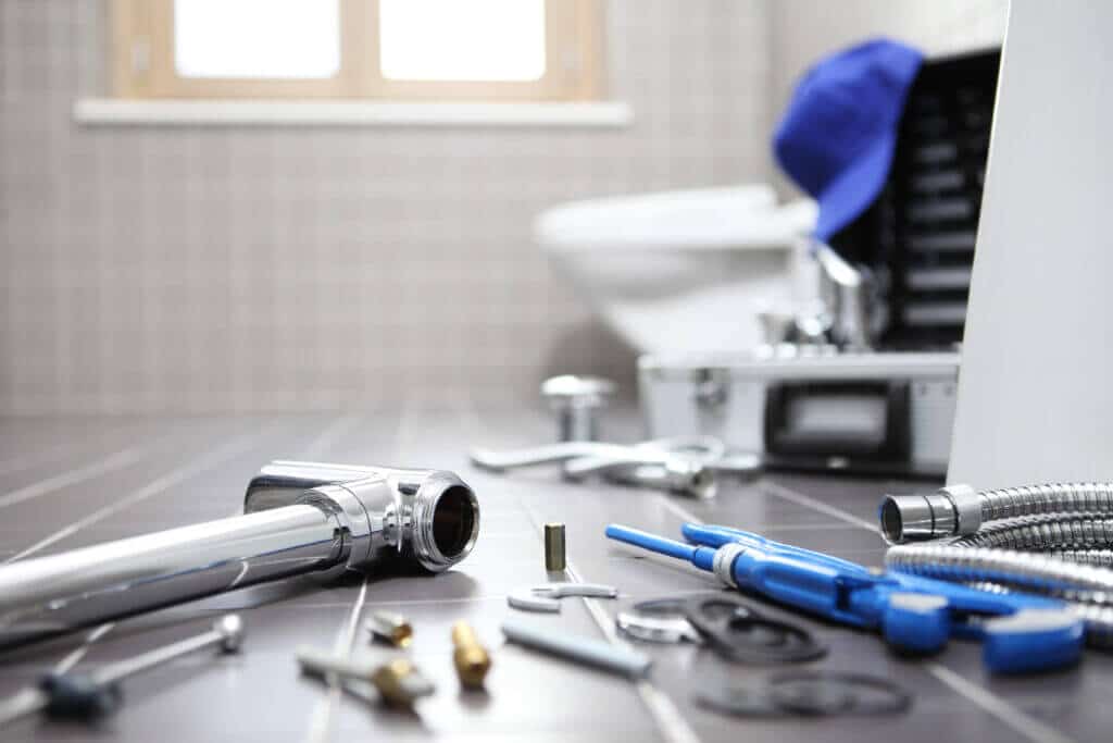 plumber tools and equipment in a bathroom, plumbing repair service, assemble and install 