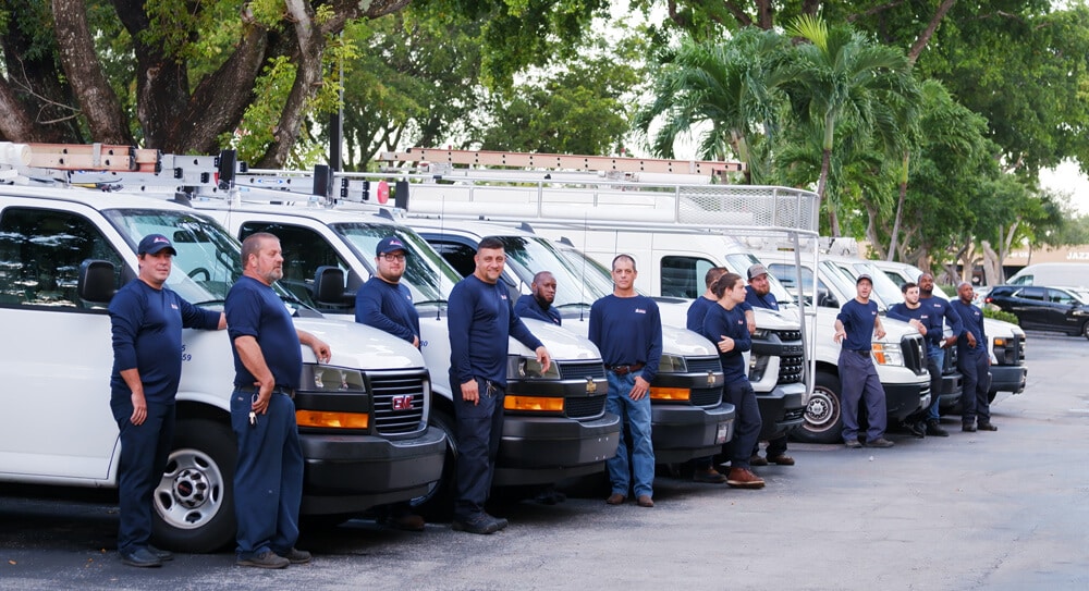 fleet of 4 star plumbing services vans and plumbers