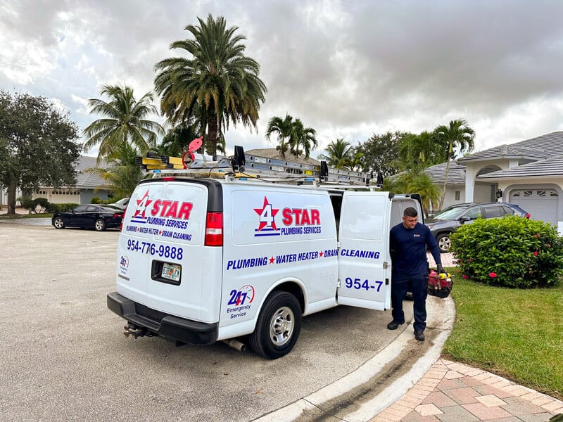 Technician getting tools out to service a tankless water heater